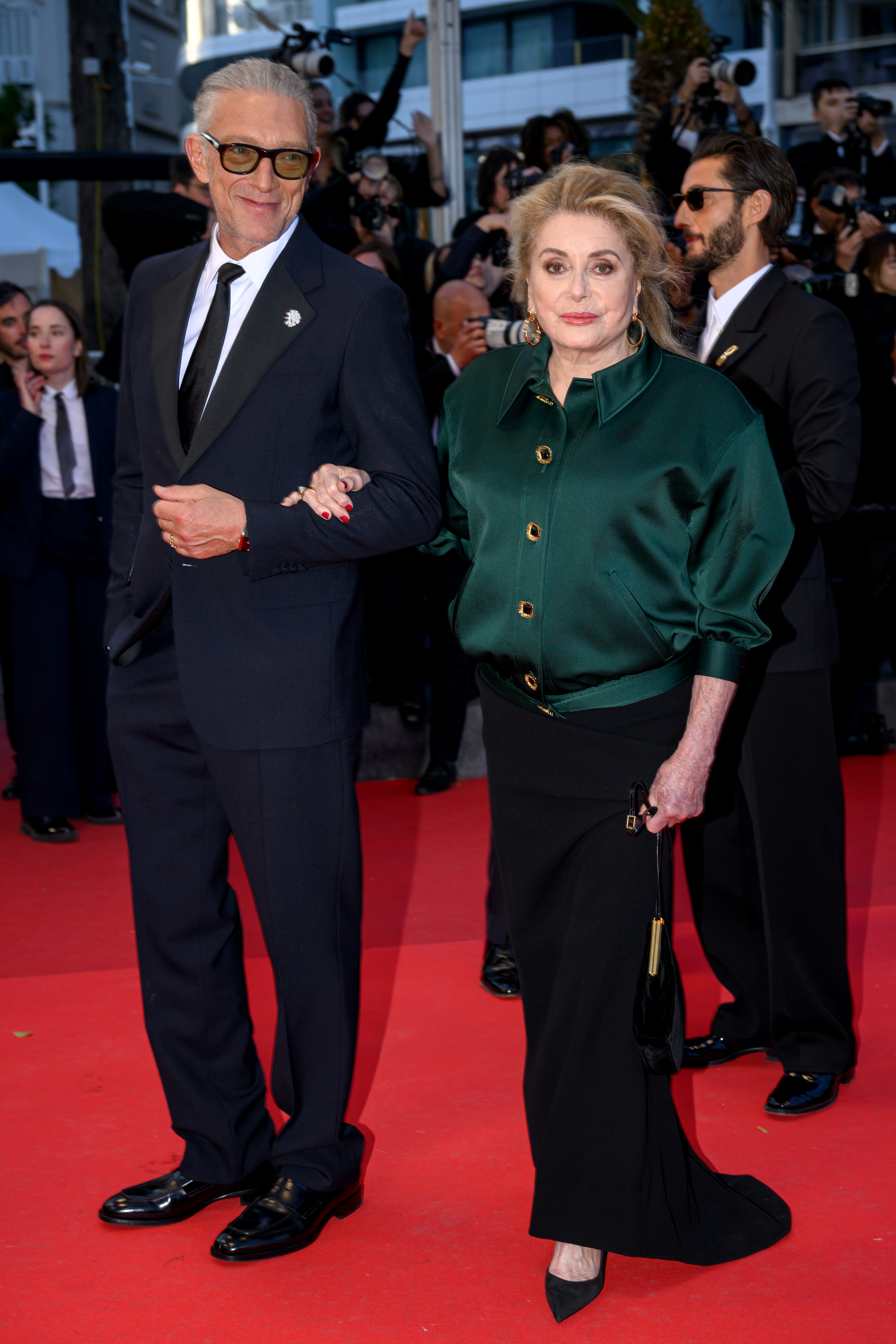 Vincent Cassel and Catherine Deneuve (wearing Saint Laurent)
