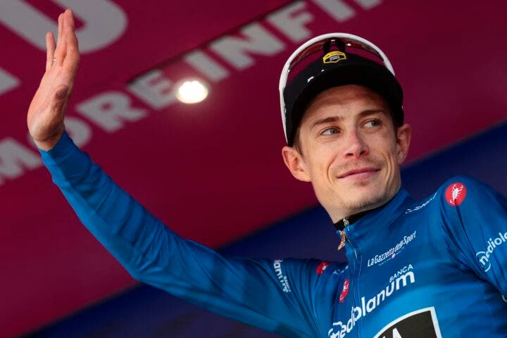 Team Visma Lease a Bike Danish rider Jonas Vingegaard wearing the best climber's blue jersey (Maglia Azzura) poses on the podium after the 11th stage of the Giro d'Italia 2026 - Tour of Italy cycling race between Porcari and Chiavari, Italy, on May 20, 2026. (Photo by )
