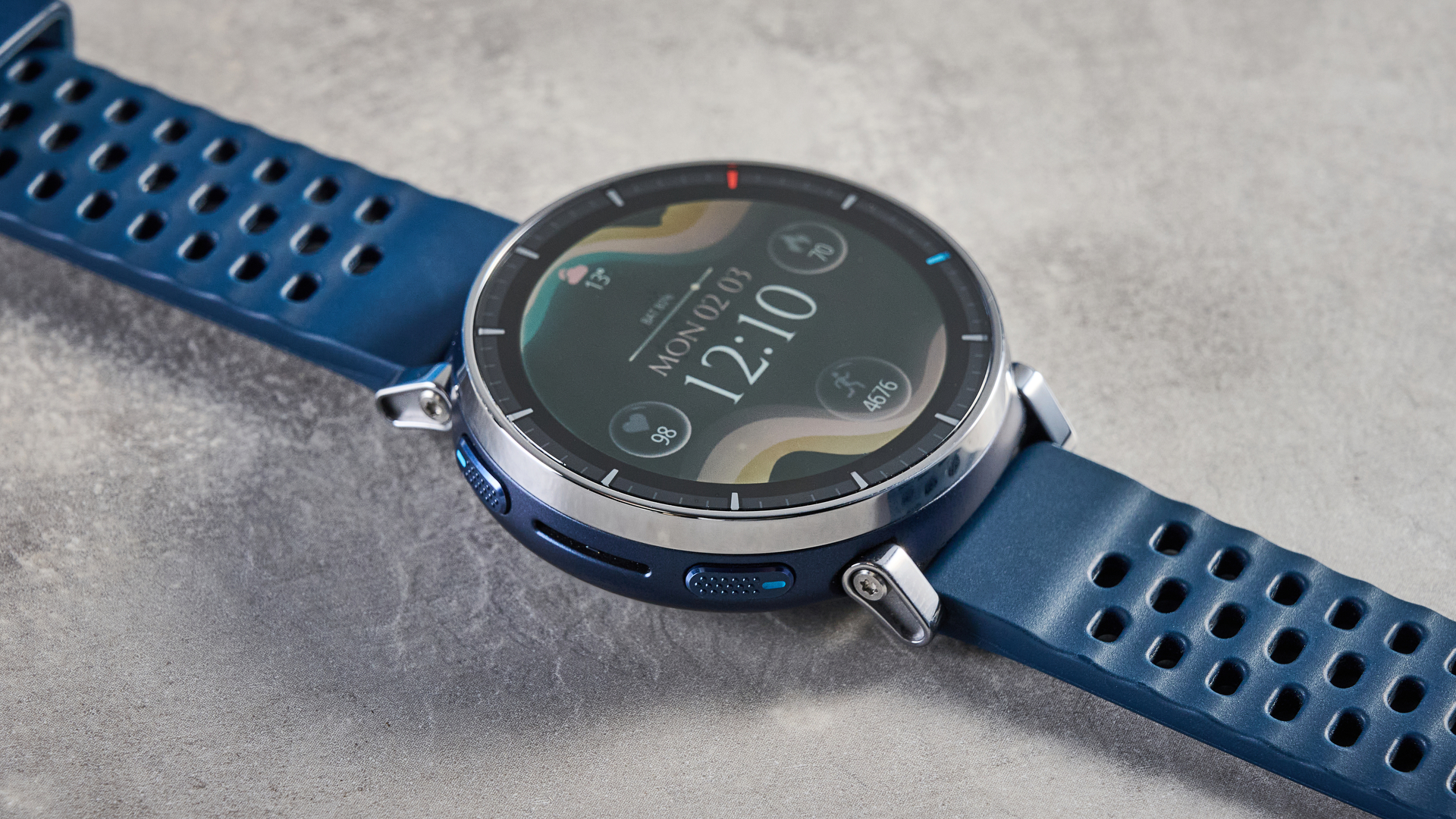 the amazfit active 3 premium photographed against the blue tom's guide background