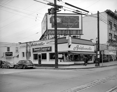 1951: Aristocratic Restaurant at 4102 Main St., the current location of Helen's Grill. Also visible are Windsor Quality Meats & Delicatessen in the 4100 block of Main Street, and billboards for