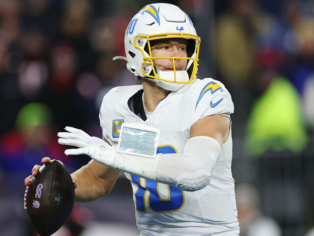 FOXBOROUGH, MASSACHUSETTS - JANUARY 11: Justin Herbert #10 of the Los Angeles Chargers in action during the AFC Wild Card Playoff game against the New England Patriots at Gillette Stadium on January 11, 2026 in Foxborough, Massachusetts.