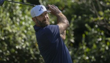 Masters champion Dustin Johnson of the United States plays a stroke from the No. 2 tee during the final round of the Masters at Augusta National Golf Club, Sunday, April 12, 2026.