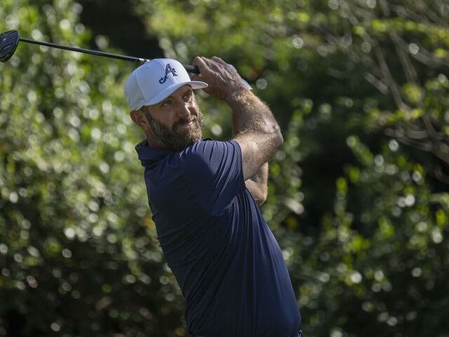 Masters champion Dustin Johnson of the United States plays a stroke from the No. 2 tee during the final round of the Masters at Augusta National Golf Club, Sunday, April 12, 2026.