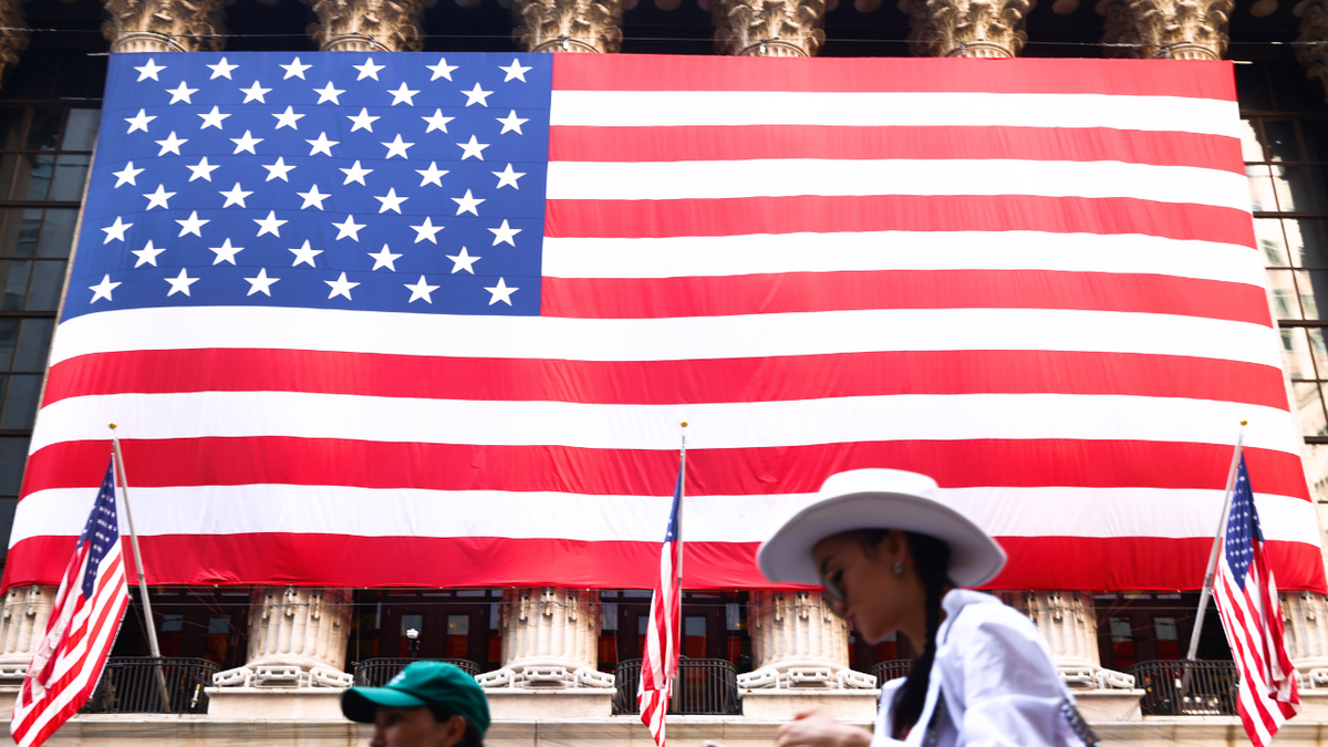 A U.S. flag is seen hanging on the exterior of the New York Stock Exchange.