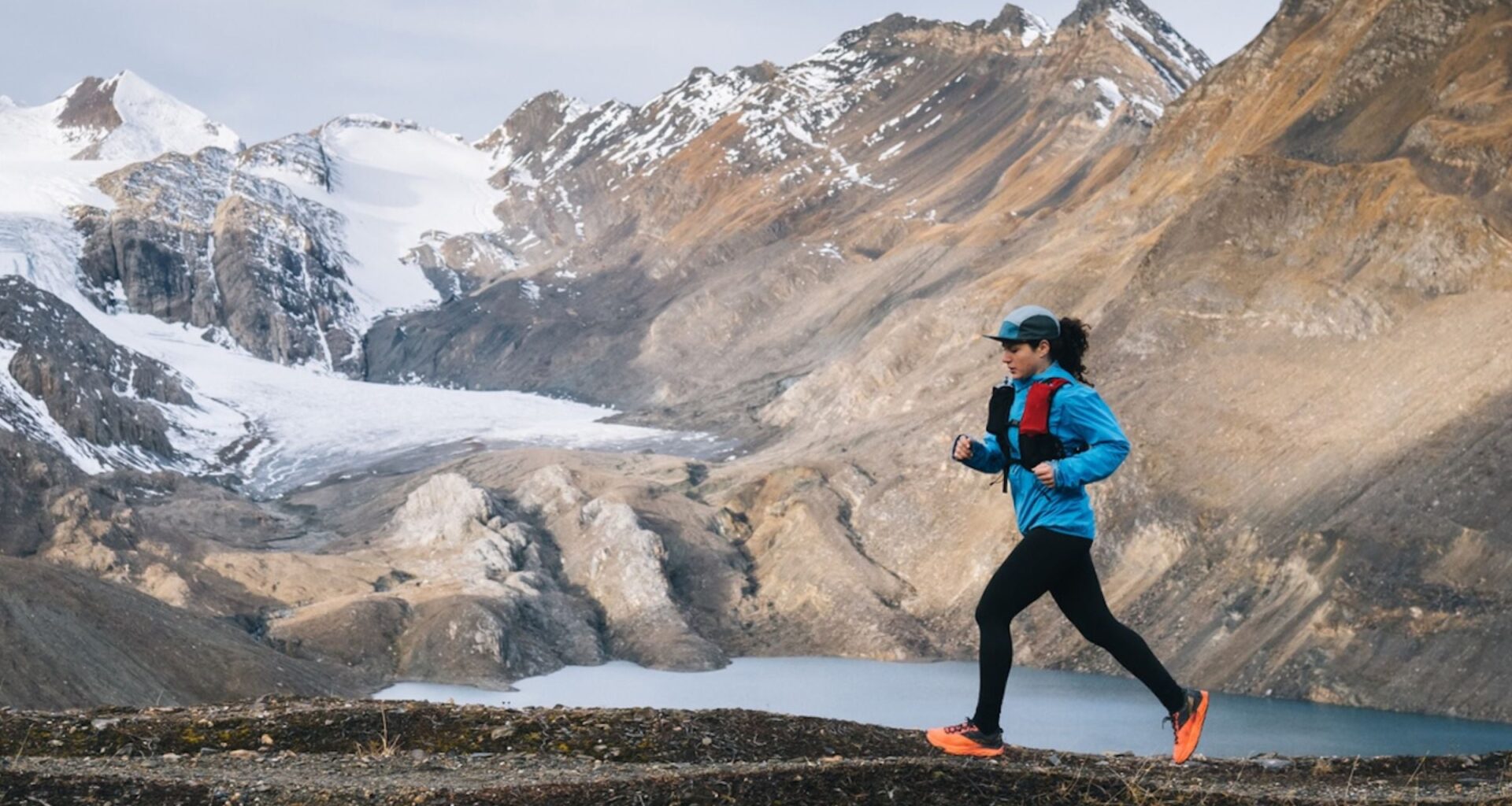 woman running by mountains