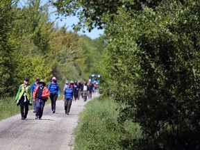 People enjoy a guided hike during the official opening of the Benallen Nature Preserve on Saturday, May 30, 2026. Greg Cowan/The Sun Times