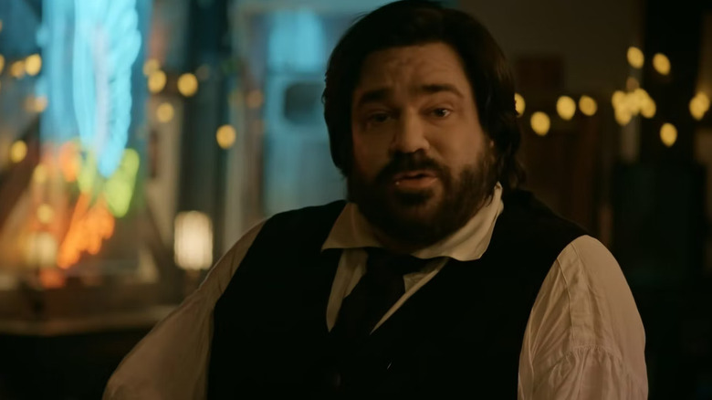 Matt Berry as Laszlo wearing a suit in What We Do in the Shadows