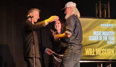 Will McGuirk accepting the DREAMS! Music Leader of the Year award n 2025