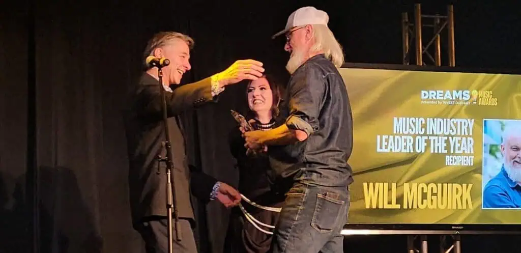 Will McGuirk accepting the DREAMS! Music Leader of the Year award n 2025