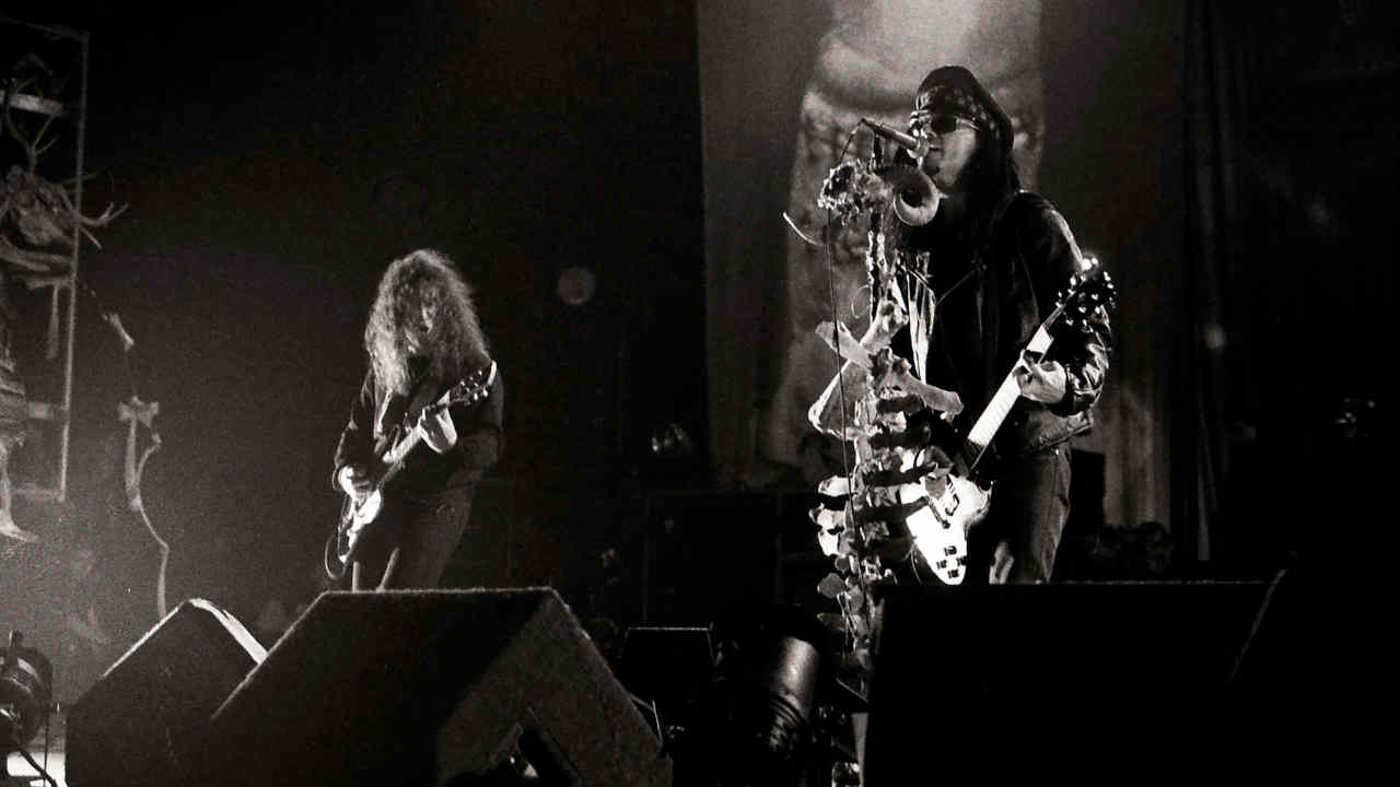 Ministry performing onstage in 1992