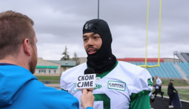 Saskatchewan Roughriders linebacker Josh Woods speaks with reporter Scott Roblin on the sidelines at Rider training camp on May 21, 2026.