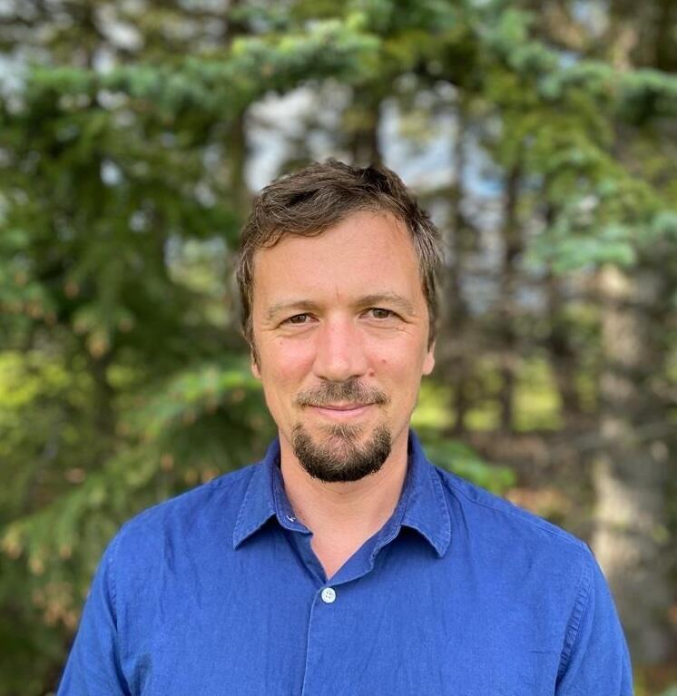 A man standing in the forest