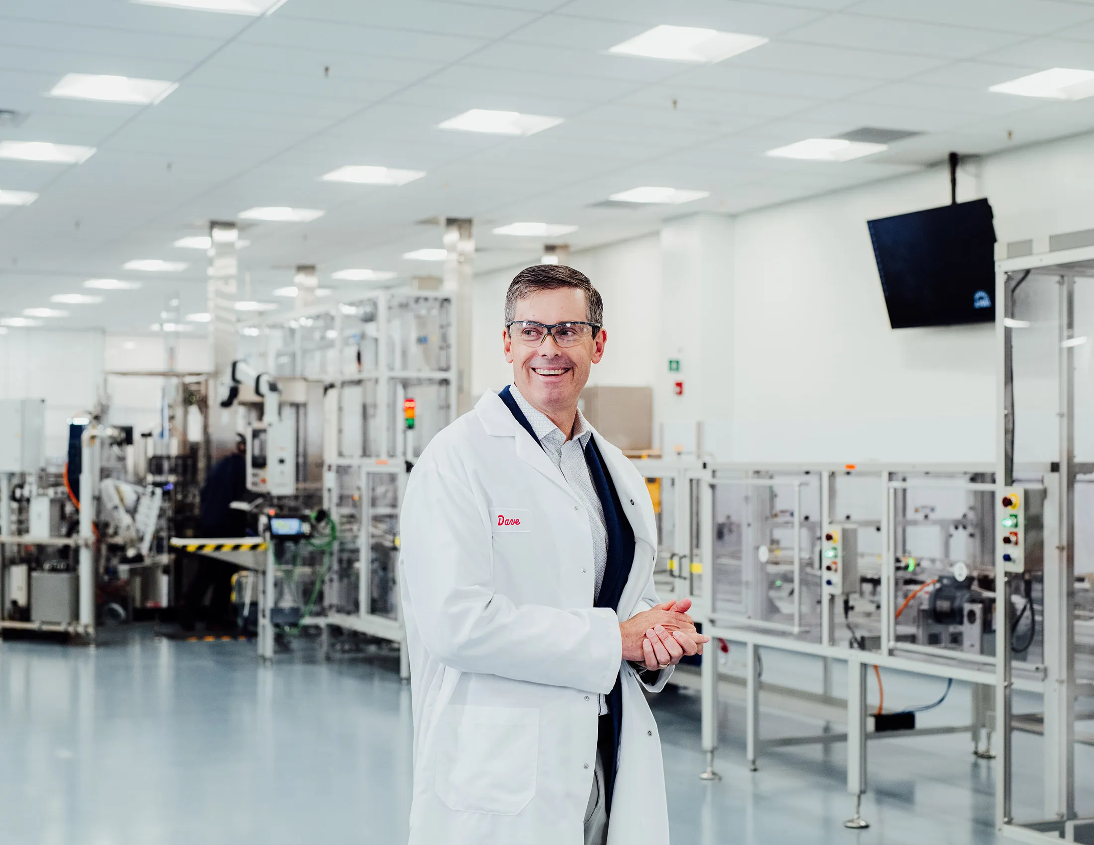 Dave Ricks, CEO of Eli Lilly, wears a lab coat at their headquarters in Indianapolis, IN.