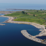 Offshore breakwater islands help protect and shape the restored shoreline at Jim Tovey Lakeview Conservation Area.