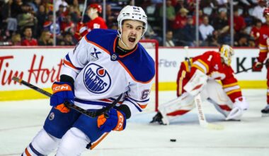 Sep 21, 2025; Calgary, Alberta, CAN; Edmonton Oilers center Connor Clattenburg (64) celebrates his goal against Calgary Flames goaltender Devin Cooley (1) during the third period at Scotiabank Saddledome. Mandatory Credit: Sergei Belski-Imagn Images