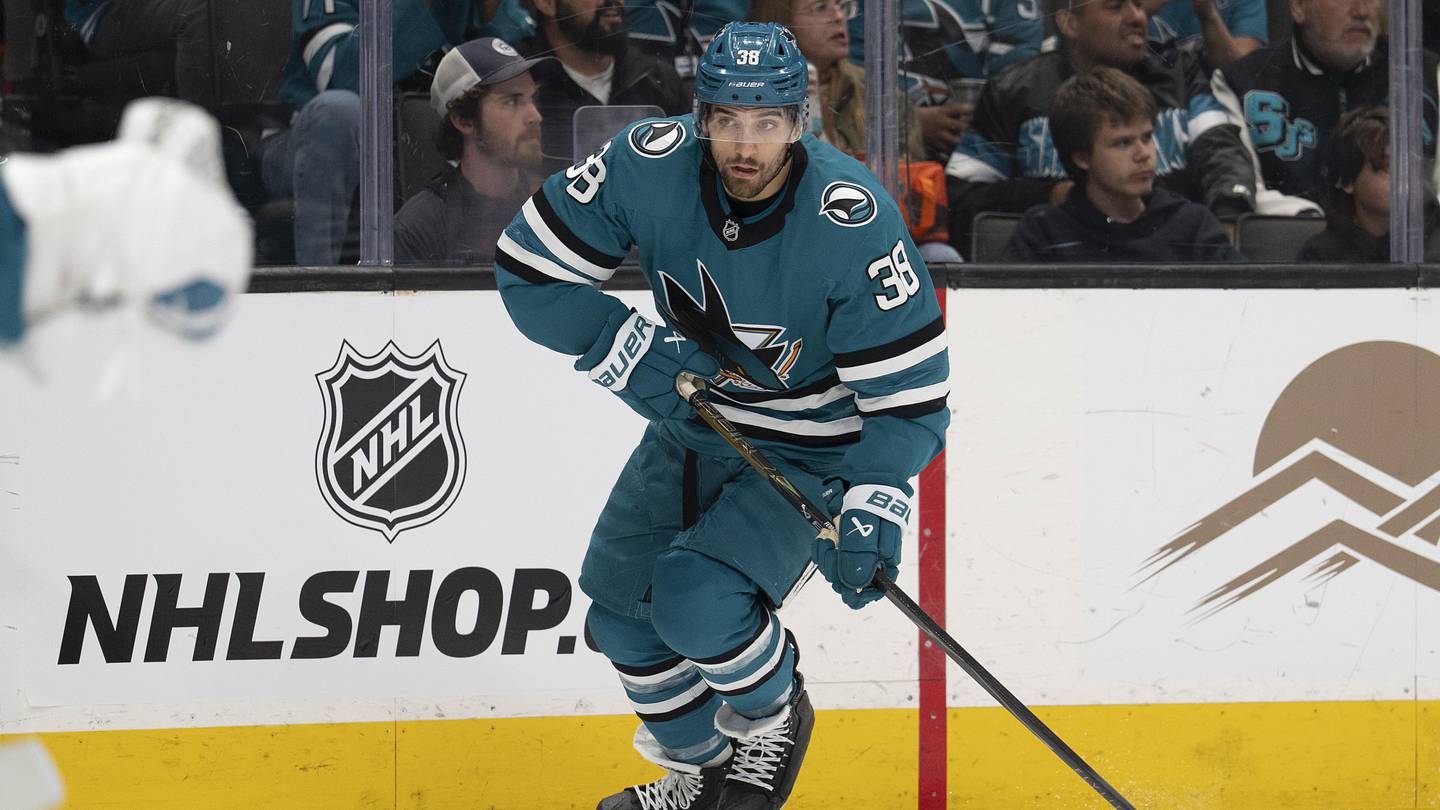 Apr 11, 2026; San Jose, California, USA;  San Jose Sharks defenseman Mario Ferraro (38) controls the puck during the first period against the Vancouver Canucks at SAP Center at San Jose. Mandatory Credit: Stan Szeto-Imagn Images