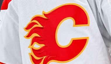 Dec 12, 2022; Montreal, Quebec, CAN; View of a Calgary Flames logo on a jersey worn by the member of the team during the second period at Bell Centre. Mandatory Credit: David Kirouac-Imagn Images