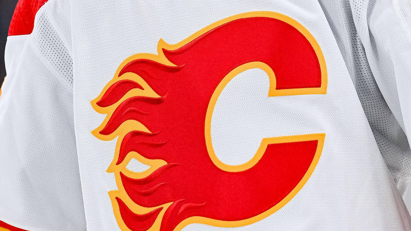 Dec 12, 2022; Montreal, Quebec, CAN; View of a Calgary Flames logo on a jersey worn by the member of the team during the second period at Bell Centre. Mandatory Credit: David Kirouac-Imagn Images