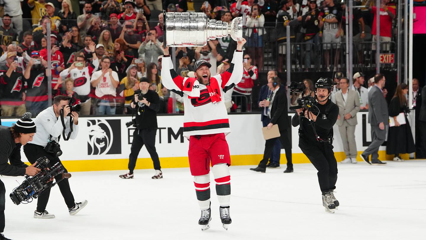 Jun 14, 2026; Las Vegas, Nevada, USA; Carolina Hurricanes left wing Taylor Hall (71) raises the the Stanley Cup after defeating the Vegas Golden Knights in game six of the 2026 Stanley Cup Final at T-Mobile Arena. Mandatory Credit: Stephen R. Sylvanie-Imagn Images
