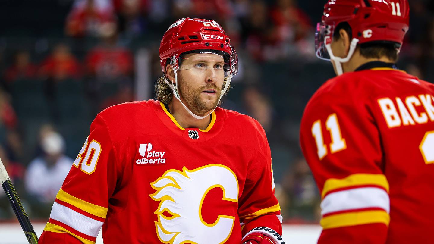 Oct 22, 2025; Calgary, Alberta, CAN; Calgary Flames left wing Blake Coleman (20) and center Mikael Backlund (11) during the second period against the Montreal Canadiens at Scotiabank Saddledome. Mandatory Credit: Sergei Belski-Imagn Images
