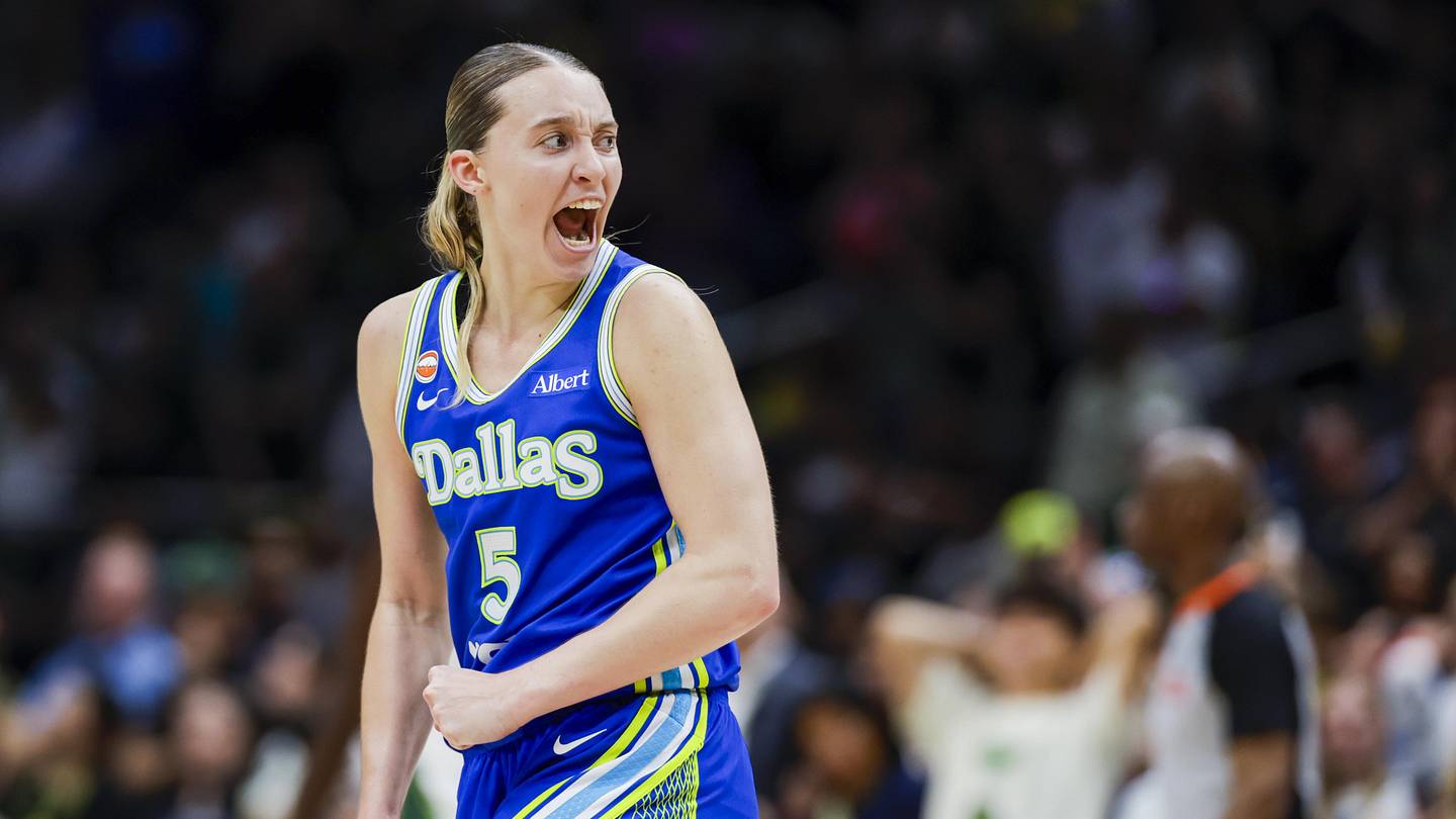 Jun 22, 2026; Seattle, Washington, USA; Dallas Wings guard Paige Bueckers (5) reacts after shooting a three-pointer against the Seattle Storm dduring the fourth quarter at Climate Pledge Arena. Mandatory Credit: Joe Nicholson-Imagn Images