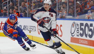 Nov 23, 2024; Edmonton, Alberta, CAN; Columbus Blue Jackets defensemen Zach Werenski (8) makes a pass in front of Edmonton Oilers forward Vasily Podkolzin (92) during the first period at Rogers Place. Mandatory Credit: Perry Nelson-Imagn Images
