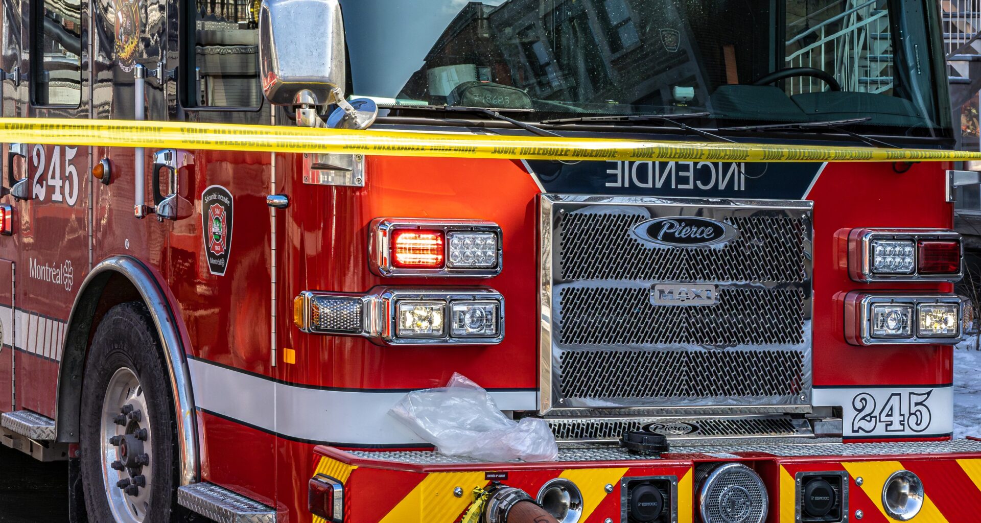 A fire truck at the five alarm fire at a two-story building at the corner of rue Notre-Dame East and rue Paul-Pau in Montreal on Thursday March 26, 2026.