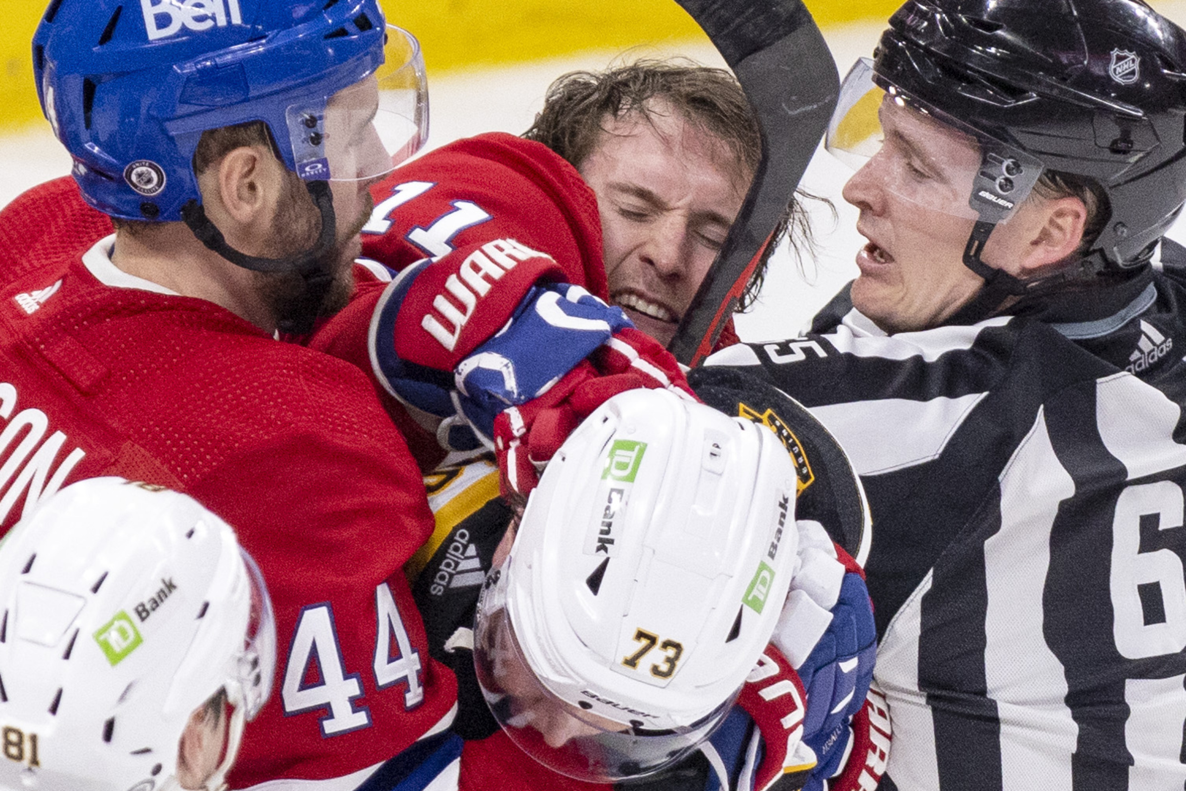 Brendan Gallagher struggles in a scrum of players and a referee.