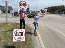Cottage owner Julie Johnson of Nepean, right, and Louise Henney of Newburgh protest the proposed Alto high-speed rail project on Highway 4 on Saturday, May 1, 2026 in Kaladar Ont.