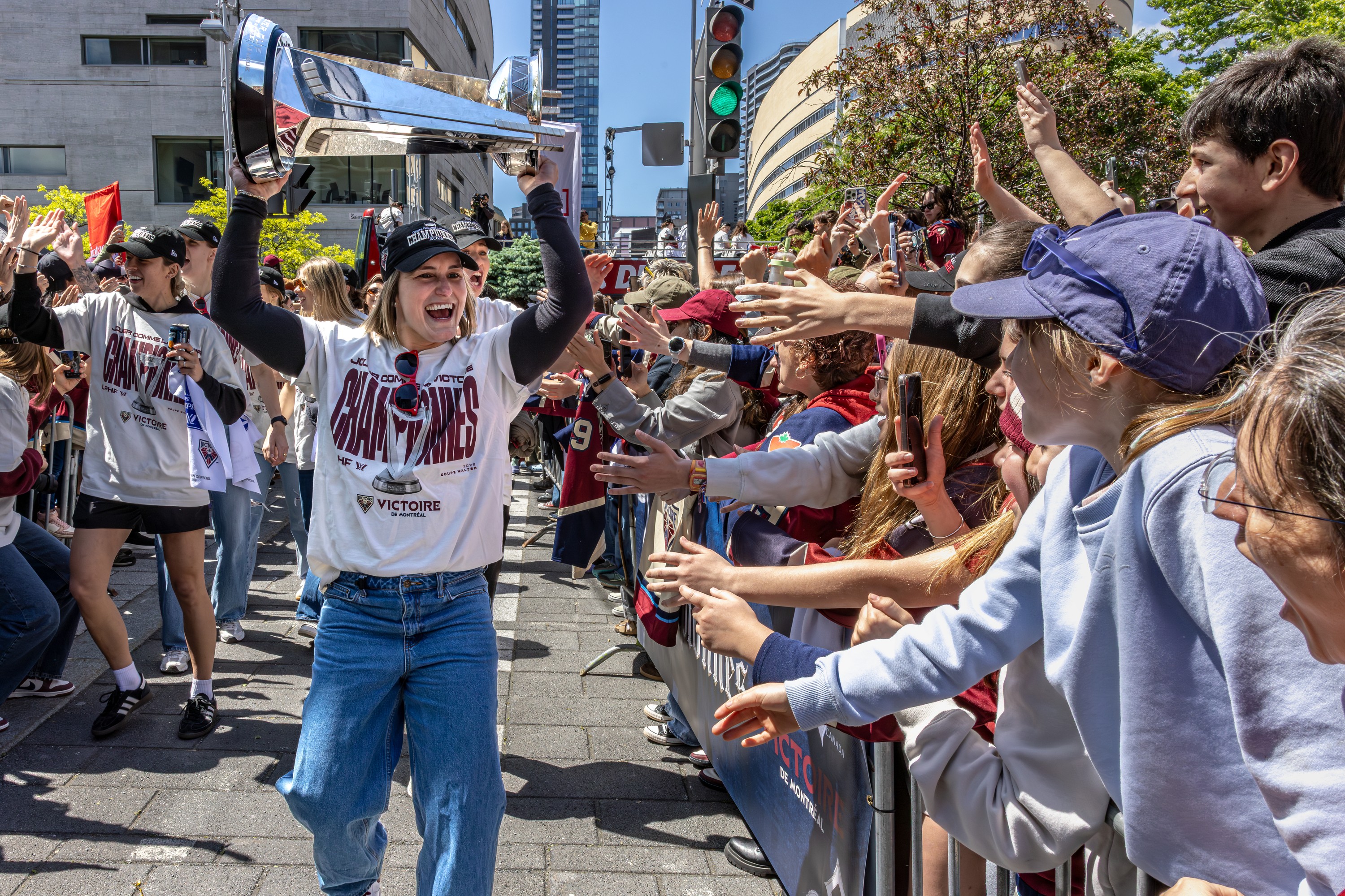 The Montreal Victoire captain Marie-Philip Poulin hoists The Walter Cup for the fans who showed up to celebrate the team's PWHL championship.