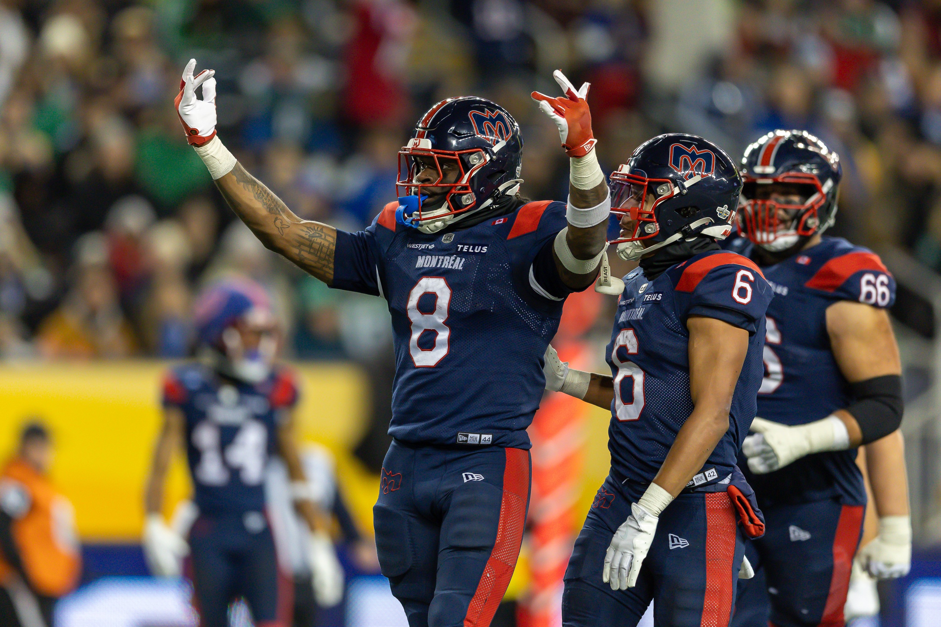 Alouettes' Stevie Scott III, left, celebrates after a touchdown with Tyson Philpot during Grey Cup against the Saskatchewan Roughriders in Winnipeg on Nov. 16.