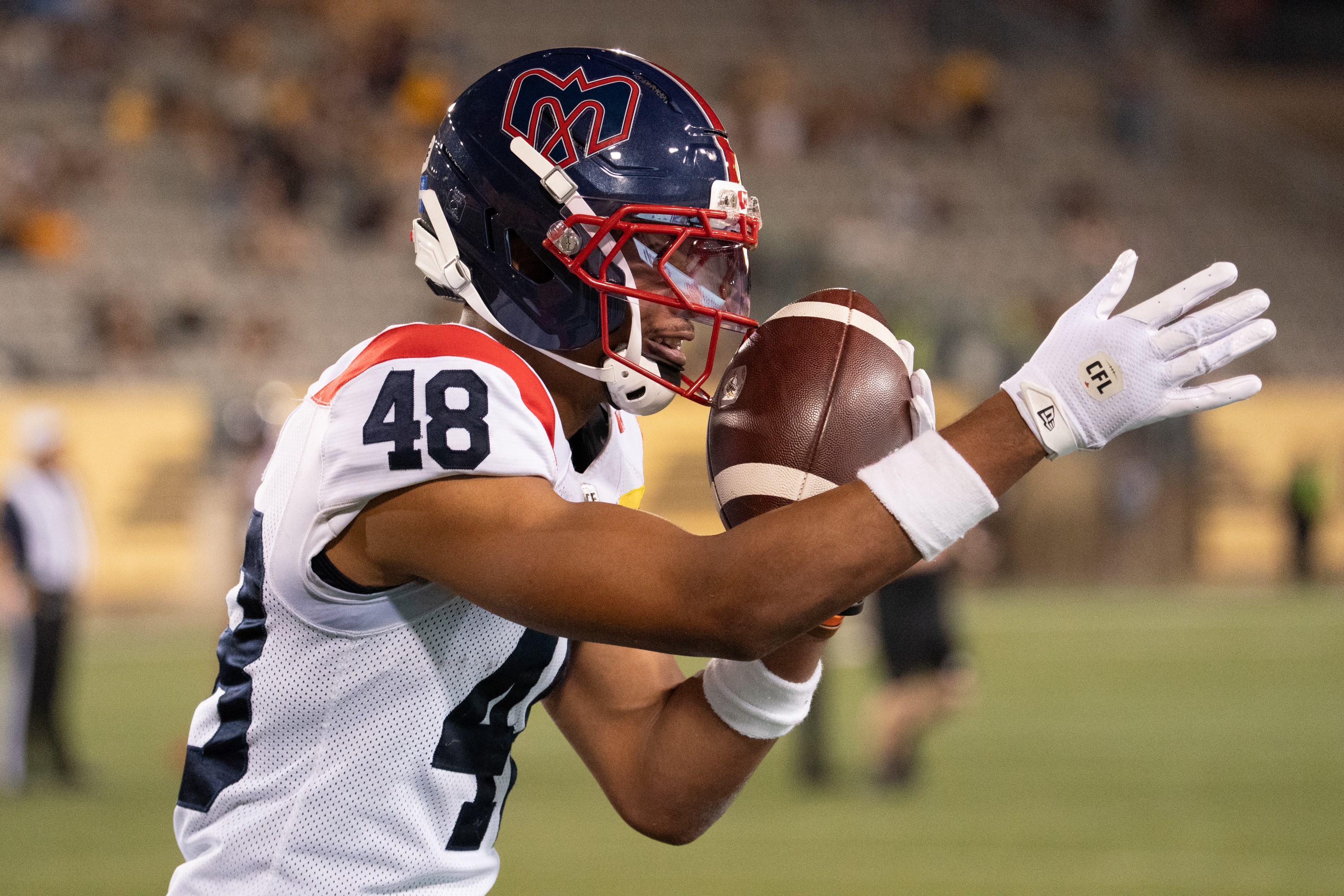 Alouettes defensive-back Kabion Ento taunts the crowd after his fumble recovery during second half against the Tiger Cats in Hamilton on Thursday night.