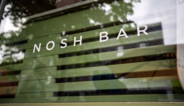 Close-up of restaurant signage reading: Nosh Bar