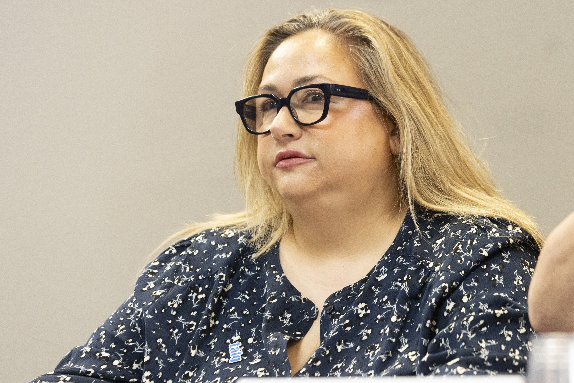 Katherine Korakakis sits at a table.