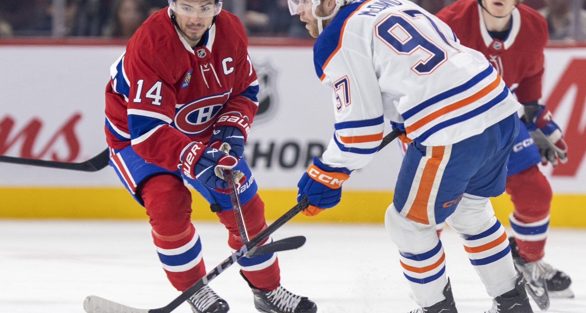 Canadiens captain Nick Suzuki pursues Edmonton Oilers centre Connor McDavid during first period in Montreal on Nov. 18, 2024.