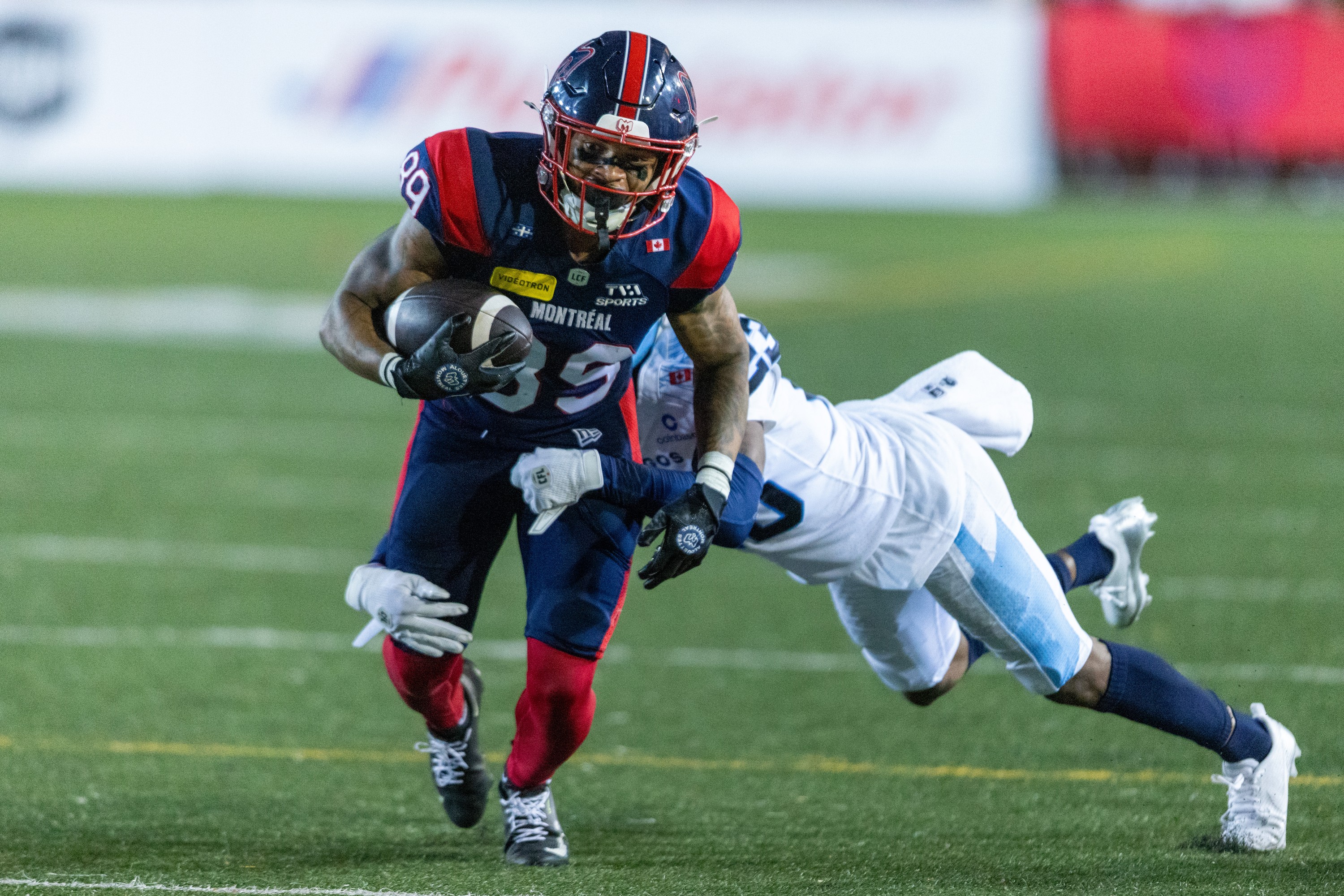 Alouettes receiver Jerreth Sterns is tackled by Toronto Argonauts defensive-back Benjie Franklin during second half in Montreal on Friday.