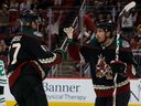 Lawson Crouse (left) and Nick Schmaltz of the Arizona Coyotes celebrate after a goal against the Dallas Stars during a game in 2022.