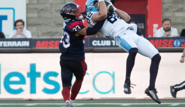 Alouettes defensive-back Arthur Hamlin brings down Toronto Argonauts receiver Tyler Kahmann during first half in Montreal on June 12.
