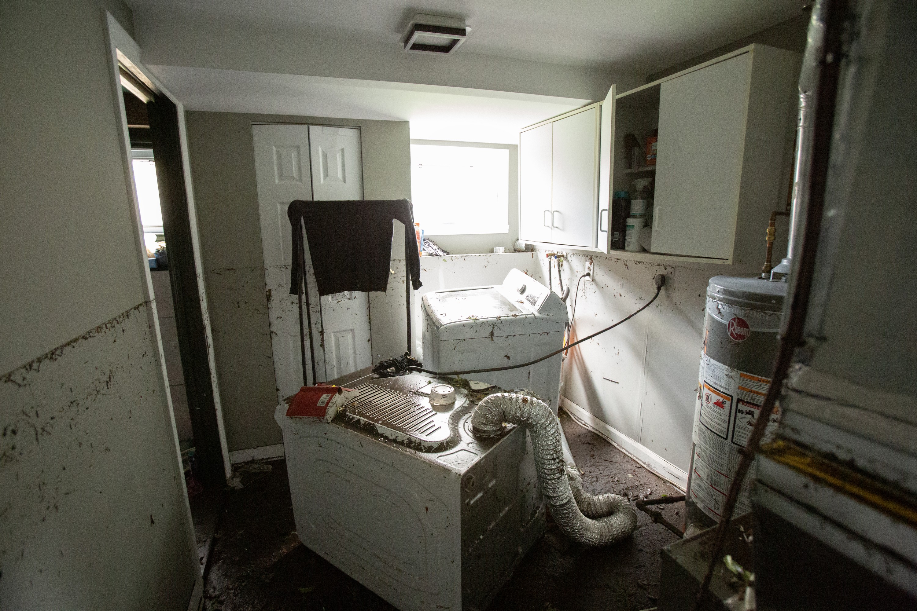 A basement shows signs of flood damage.