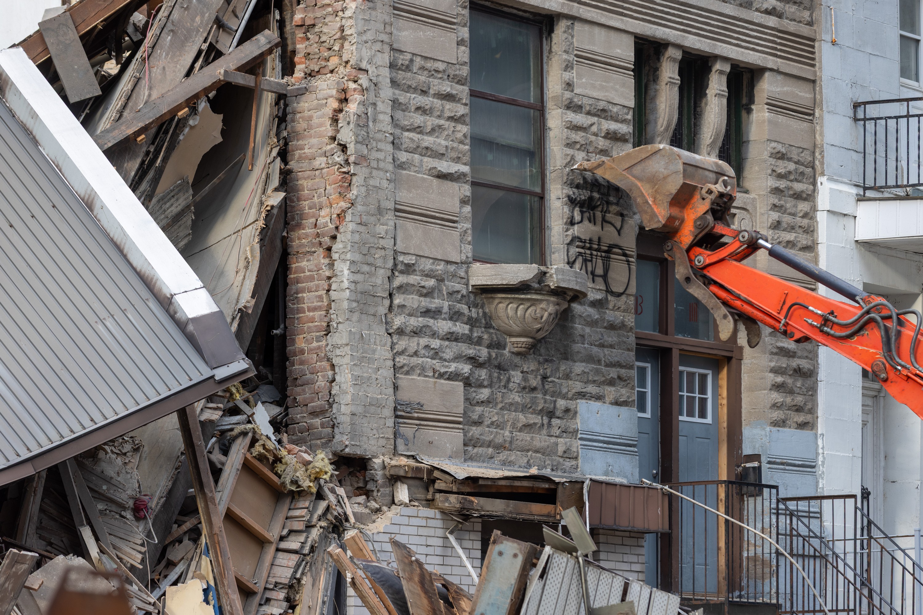 An excavator at the scene of a building collapse on the corner of René-Lévesque Boulevard and Saint-Denis Street in Montreal on Tuesday, June 23, 2026. 