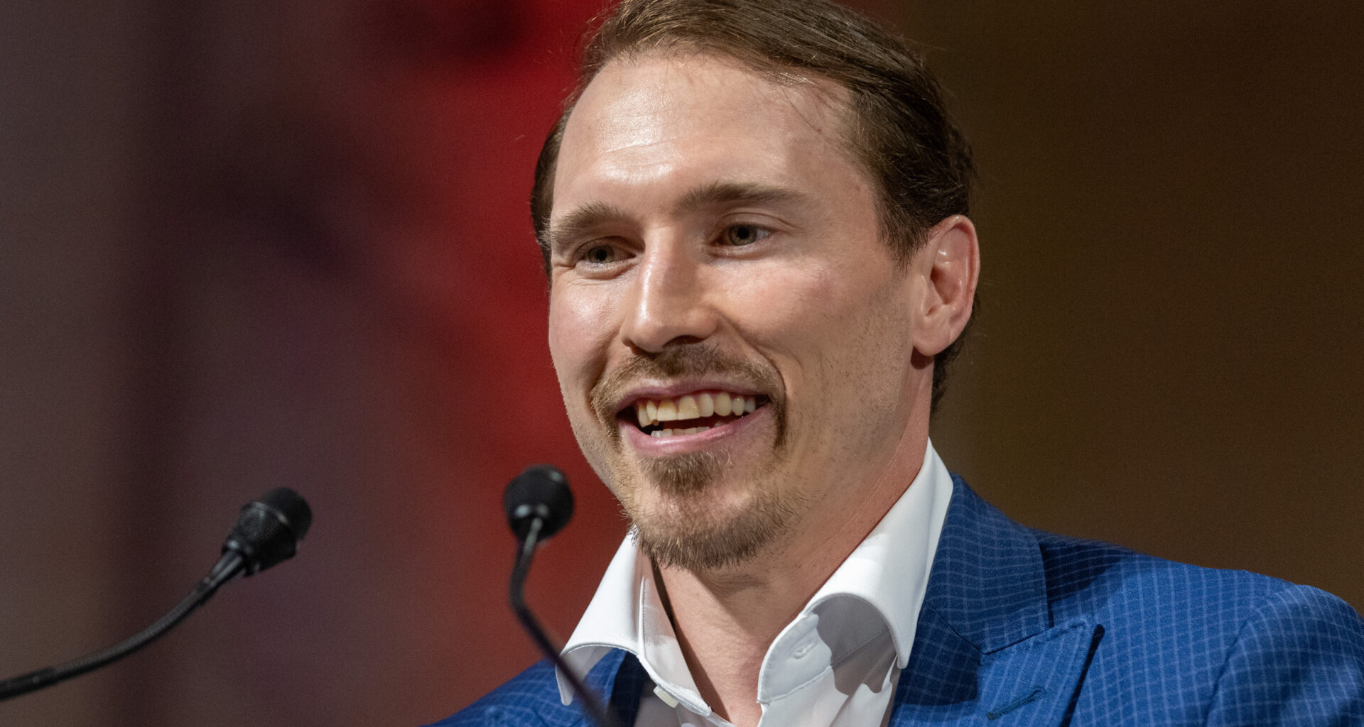 Brendan Gallagher speaks at a podium