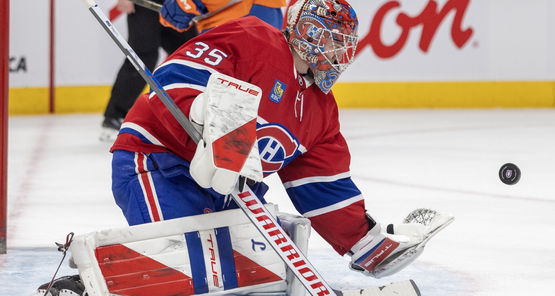 Canadiens' Samuel Montembeault makes a glove save against the New York Islanders during second period in Montreal on Feb. 26, 2026.