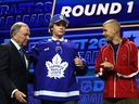 From left, NHL commissioner
 Gary Bettman, Gavin McKenna, and Justin Bieber are on stage after McKenna was drafted by the Toronto Maple Leafs with the first overall pick during day one of the 2026 NHL Draft on June 26, 2026 in Buffalo, N.Y
