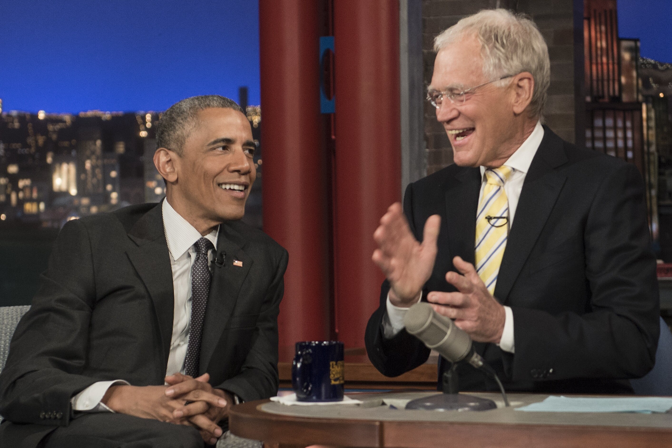 Host David Letterman gestures as he speaks with guest Barack Obama on CBS's Late Show