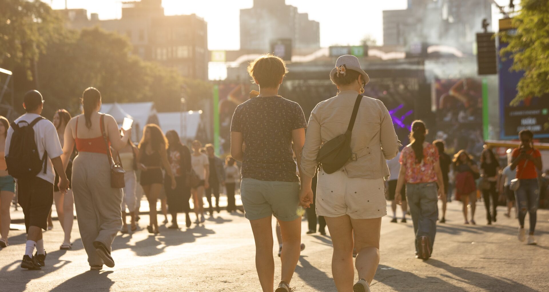 People walk toward a city skyline