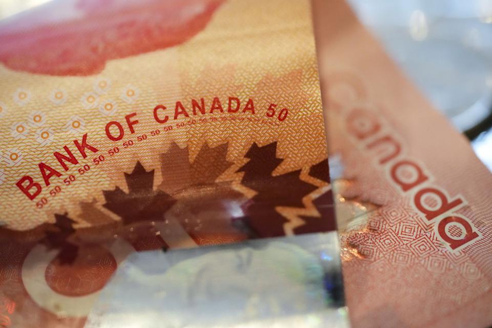The Bank of Canada wording on a Canadian 50 dollar bill is pictured in Ottawa on Wednesday, Jan. 11, 2023. THE CANADIAN PRESS/Sean Kilpatrick - The Canadian Press