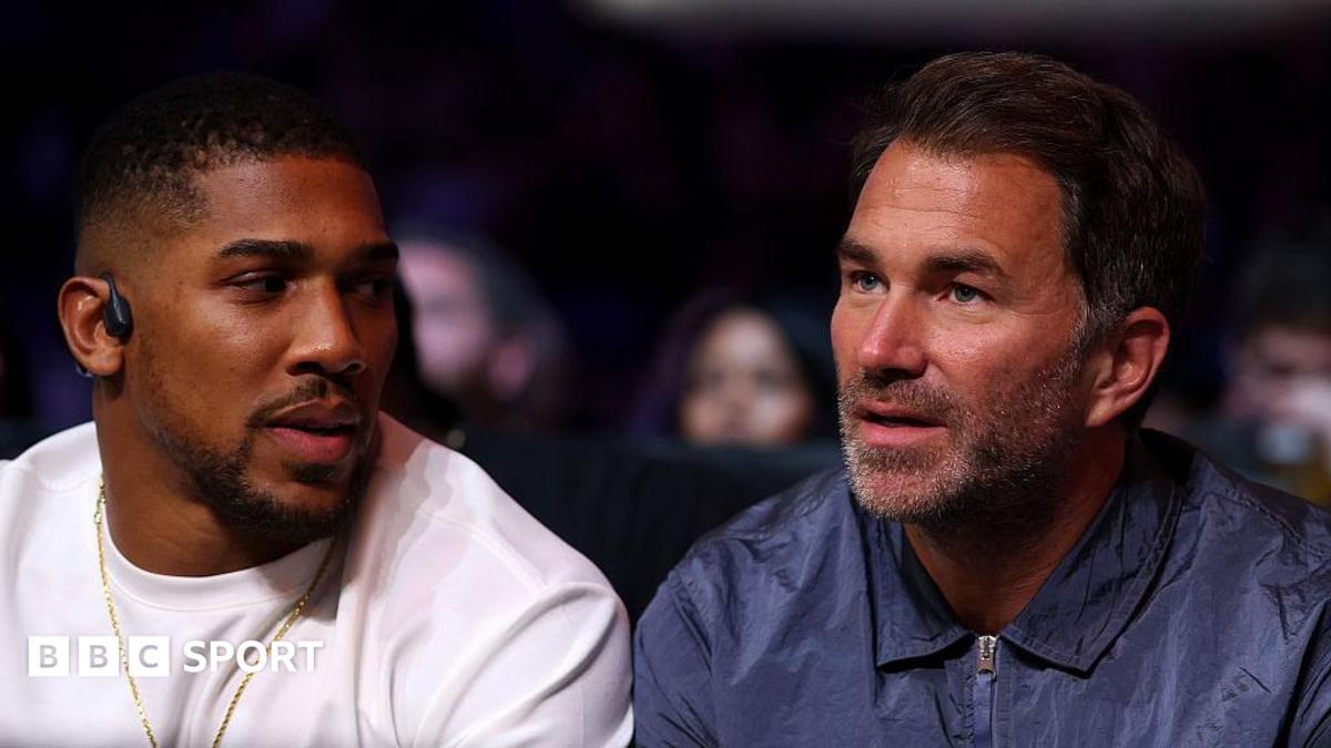 Eddie Hearn and Anthony Joshua in conversation at ringside