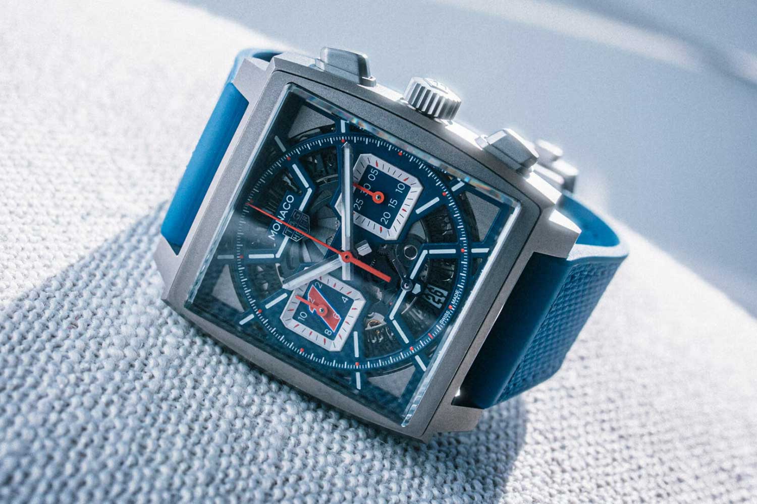 TAG Heuer Monaco Skeleton featured a blue skeletonized dial and a red number “1” on the hour counter and date wheel (Image: TAG Heuer, The Edge Magazine)