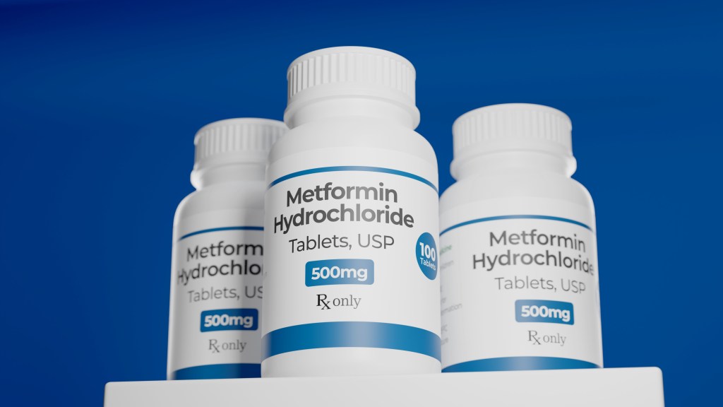 Illustration of three bottles of Metformin Hydrochloride 500mg tablets against a blue background.