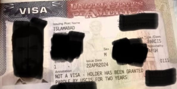 A redacted U.S. document. The photograph and identifying details have been redacted to protect the identity of the Afghan man it was issued for.